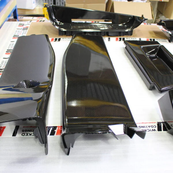 Car interior elements coated in carbon fibre