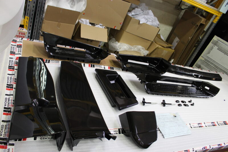 Car interior elements coated in carbon fibre