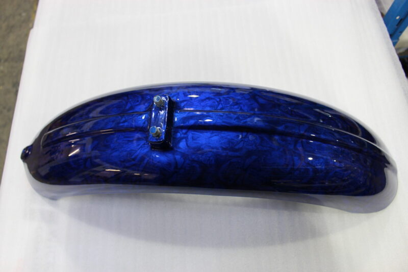 Motorbike parts coated in skulls painted blue