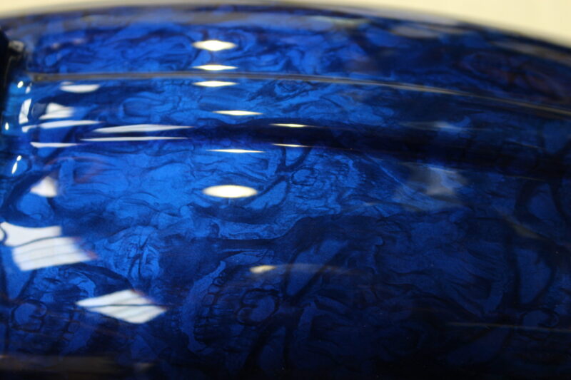 Motorbike parts coated in skulls painted blue