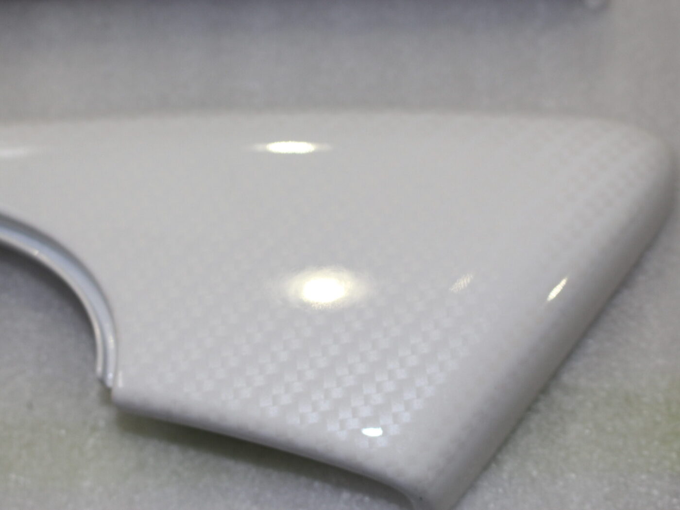 Parts of car interior coated in carbon painted white