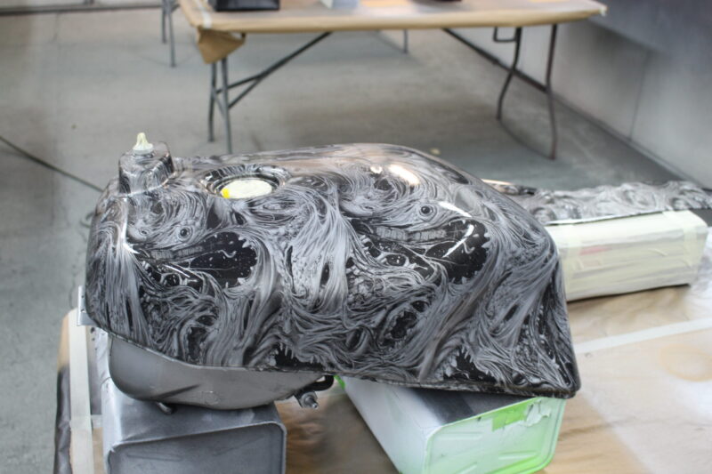 Motorbike parts coated in horror theme hydrographic film