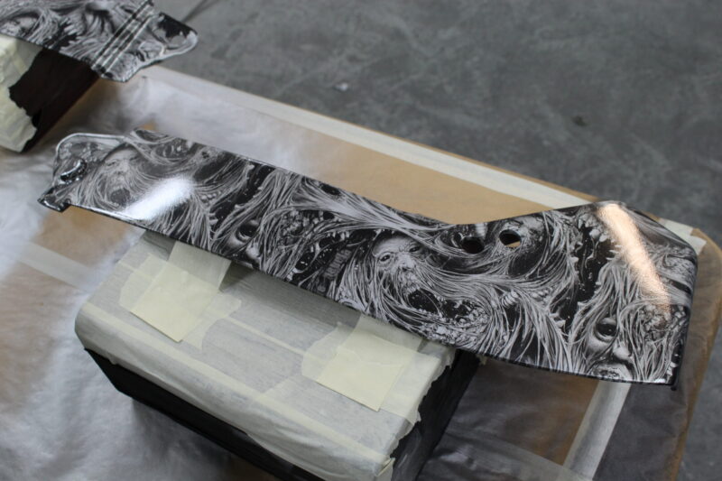 Motorbike parts coated in horror theme hydrographic film