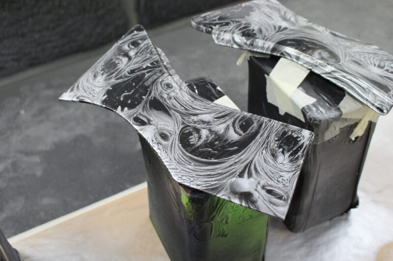 Motorbike parts coated in horror theme hydrographic film