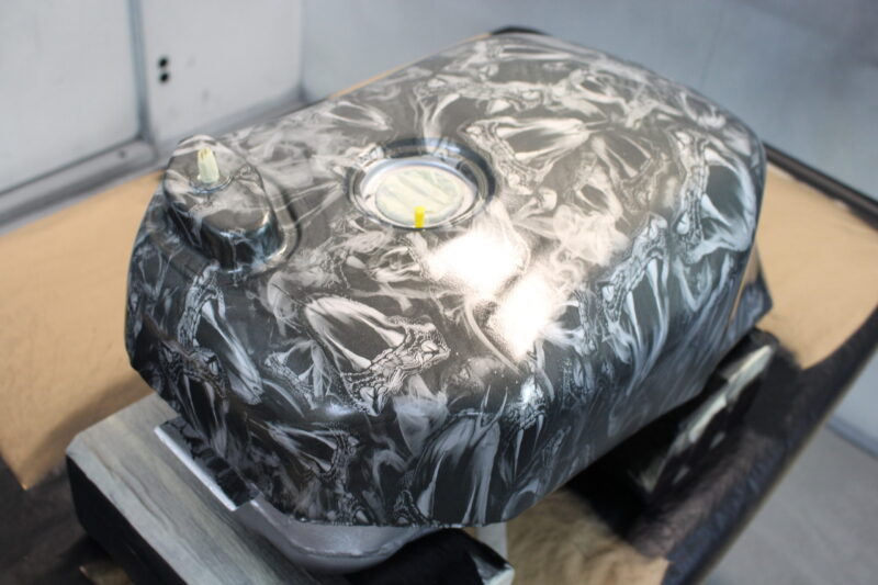 Motorbike tank coated in snakes