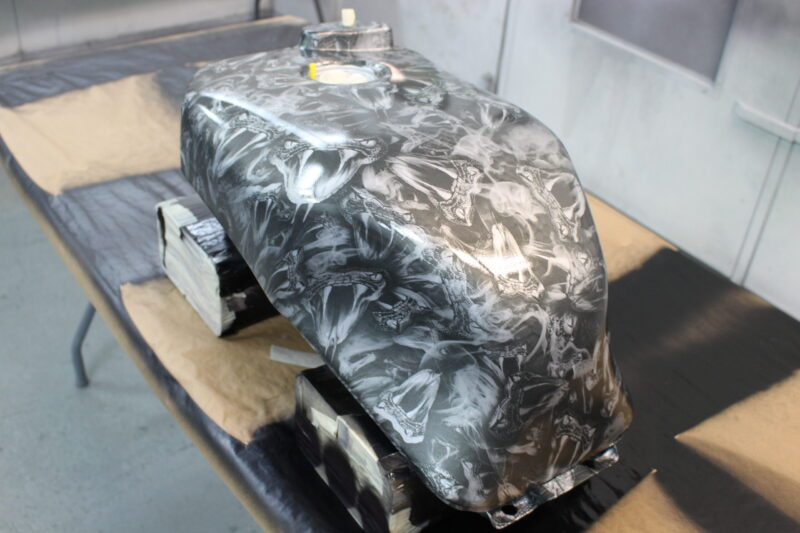 Motorbike tank coated in snakes