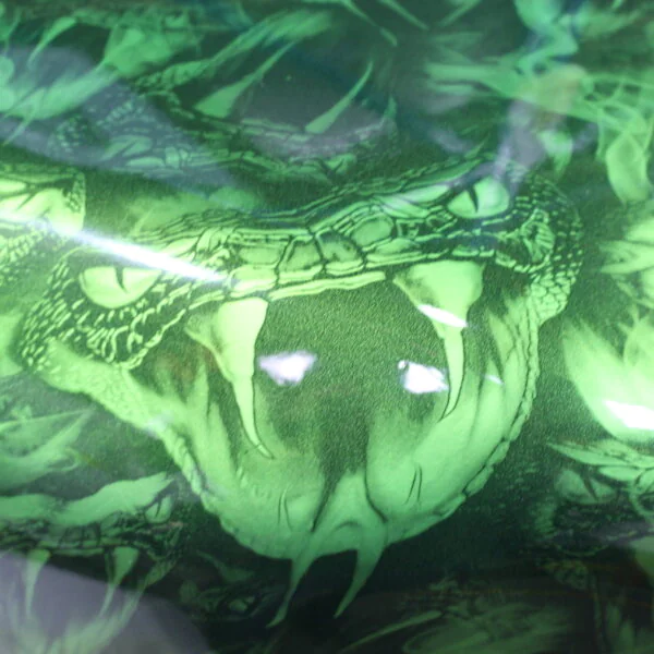 Motorbike tank coated in snakes painted green