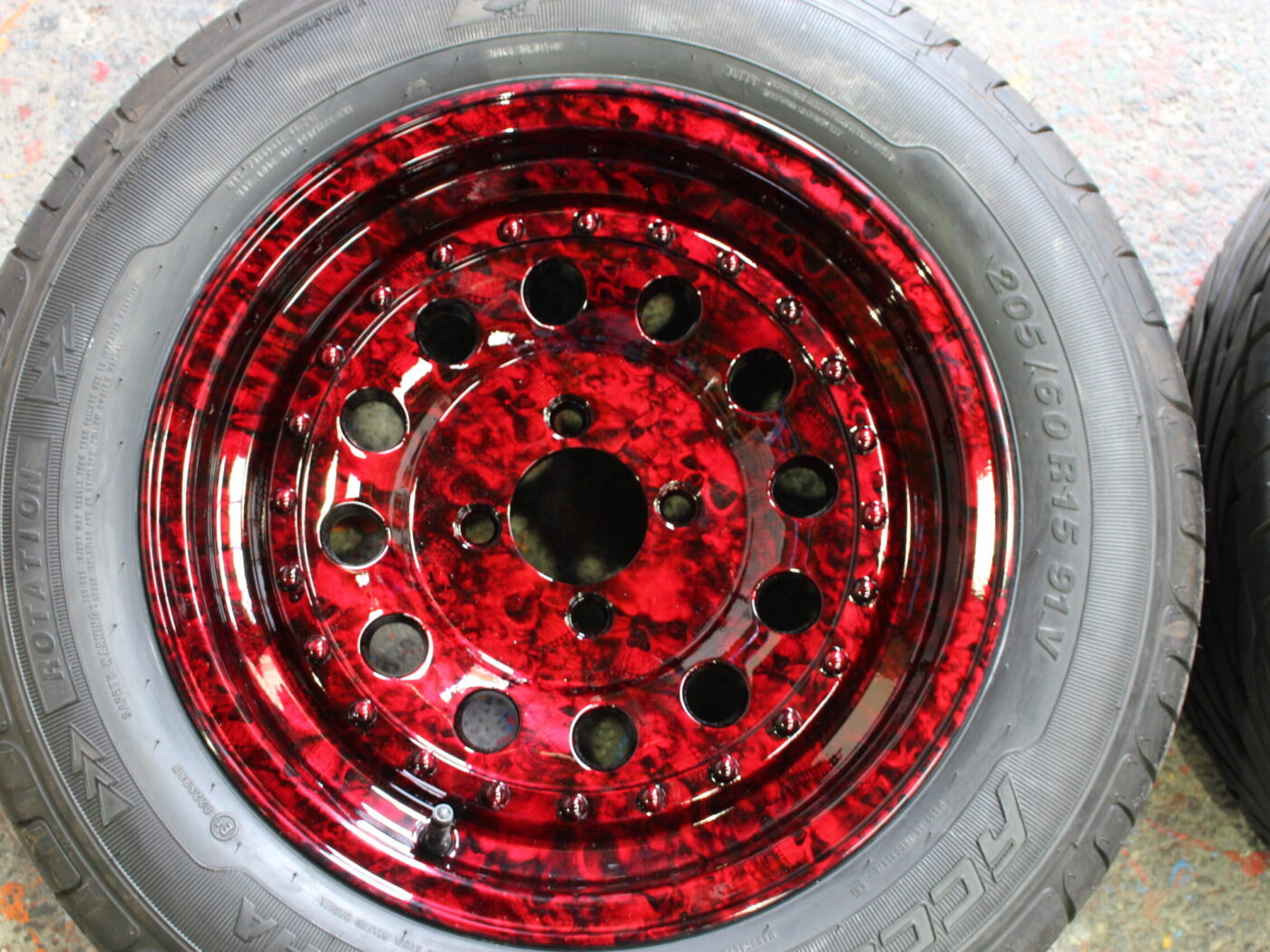 Car wheels coated in skull painted red