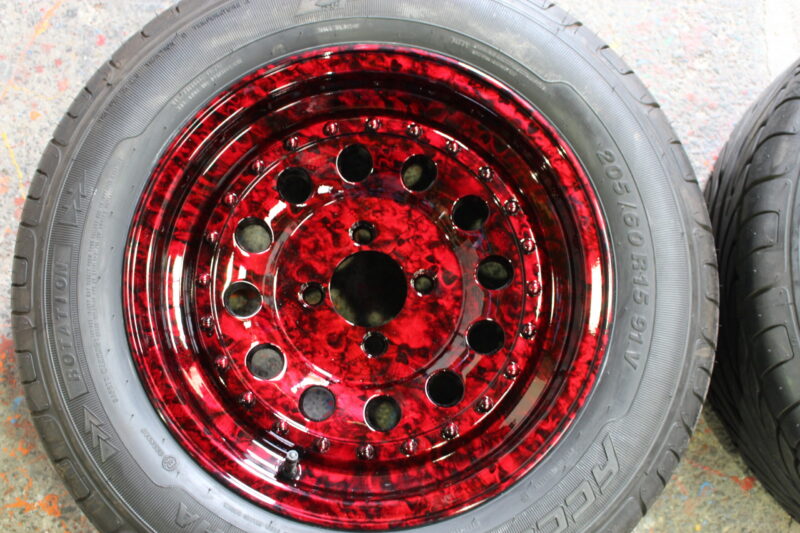 Car wheels coated in skull painted red