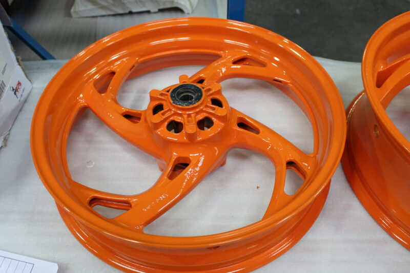 Motorbike alloy wheels painted orange