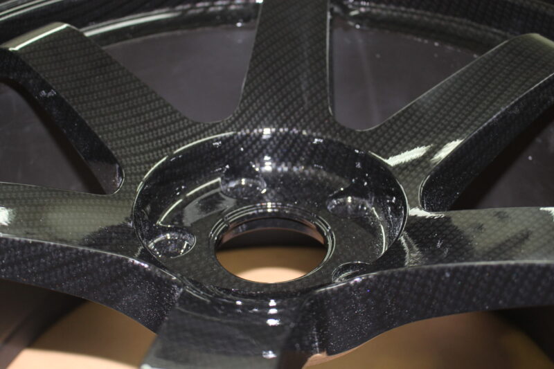 Car alloy wheels coated in carbon fibre