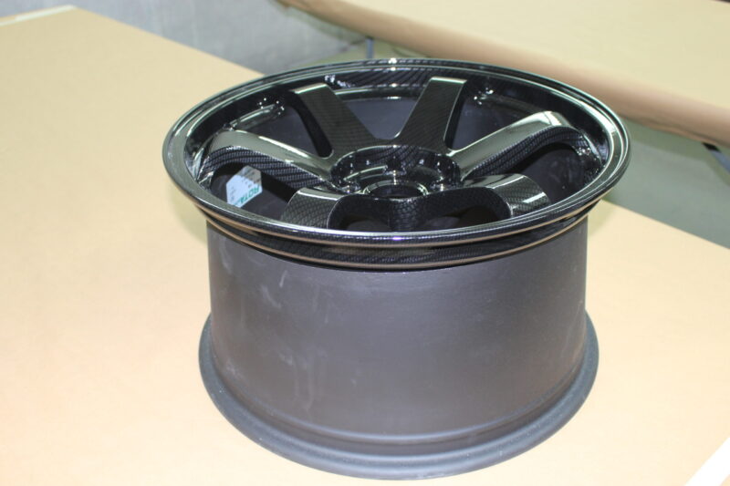 Car alloy wheels coated in carbon fibre