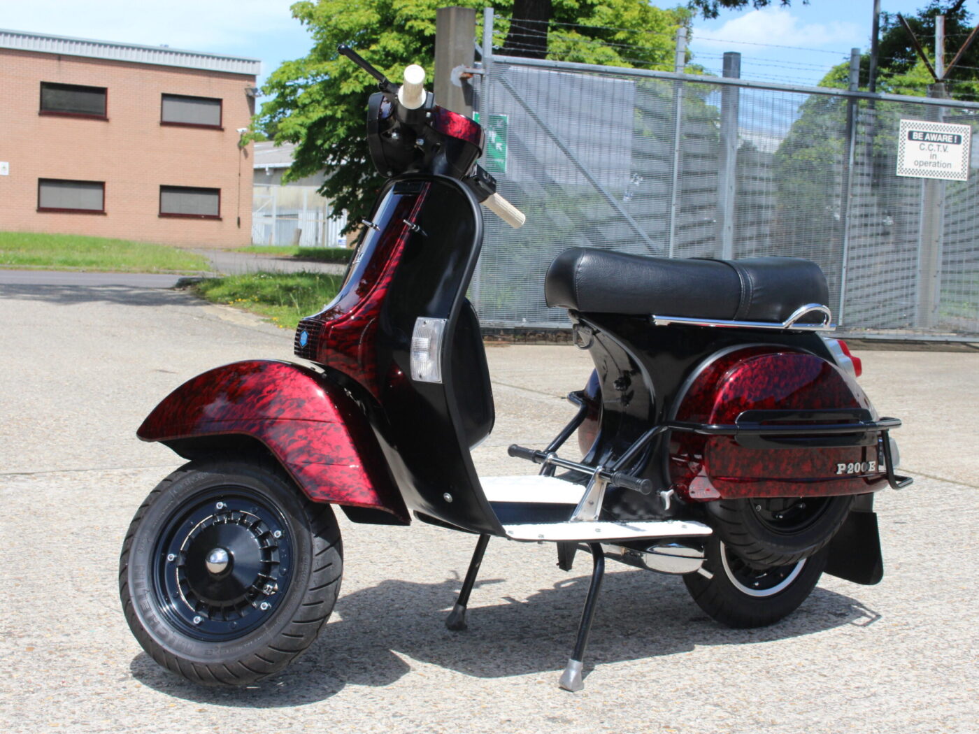 Vespa P200E skuter coated in dark skulls