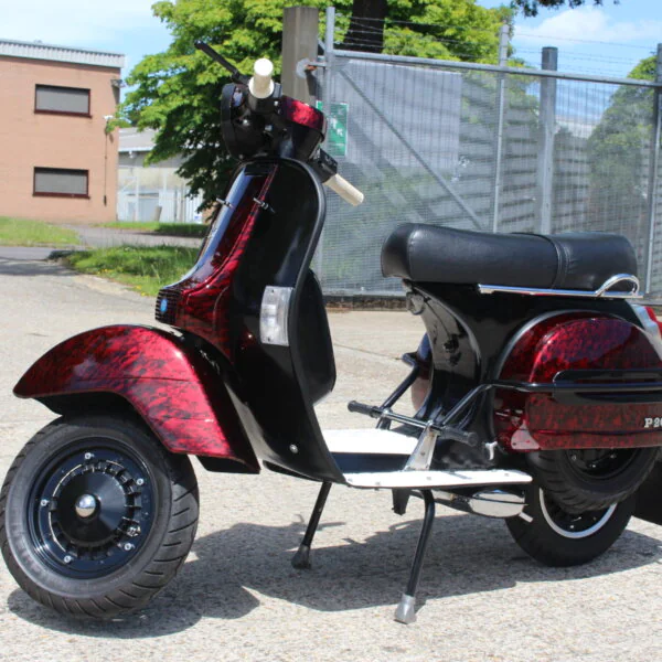 Vespa P200E skuter coated in dark skulls