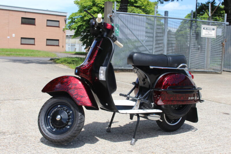 Vespa P200E skuter coated in dark skulls