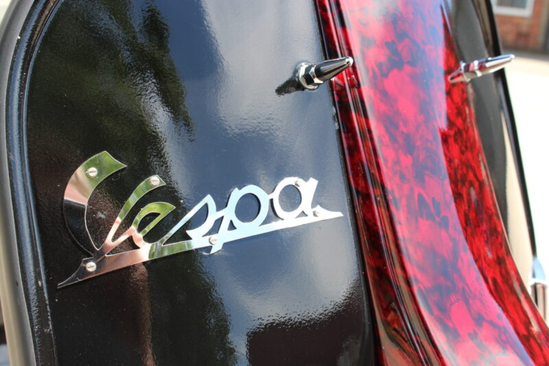 Vespa P200E skuter coated in dark skulls