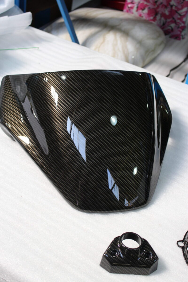 Motorbike parts coated in carbon fibre