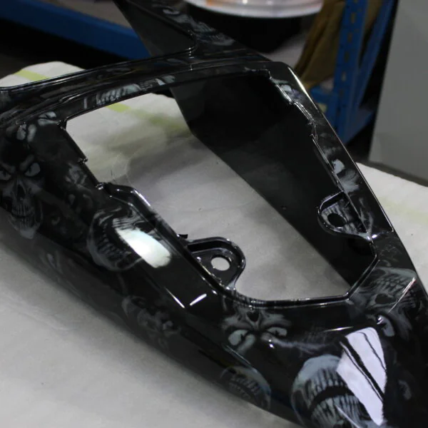 Motorbike parts coated in skulls painted black