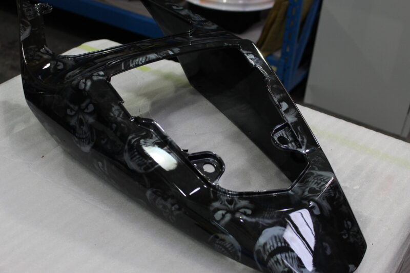Motorbike parts coated in skulls painted black