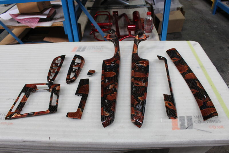 Car interior elements coated in snake hydrographic film – Wicked Coatings