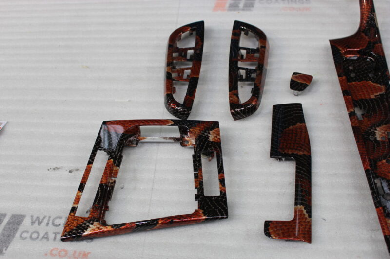 Car interior elements coated in snake hydrographic film – Wicked Coatings