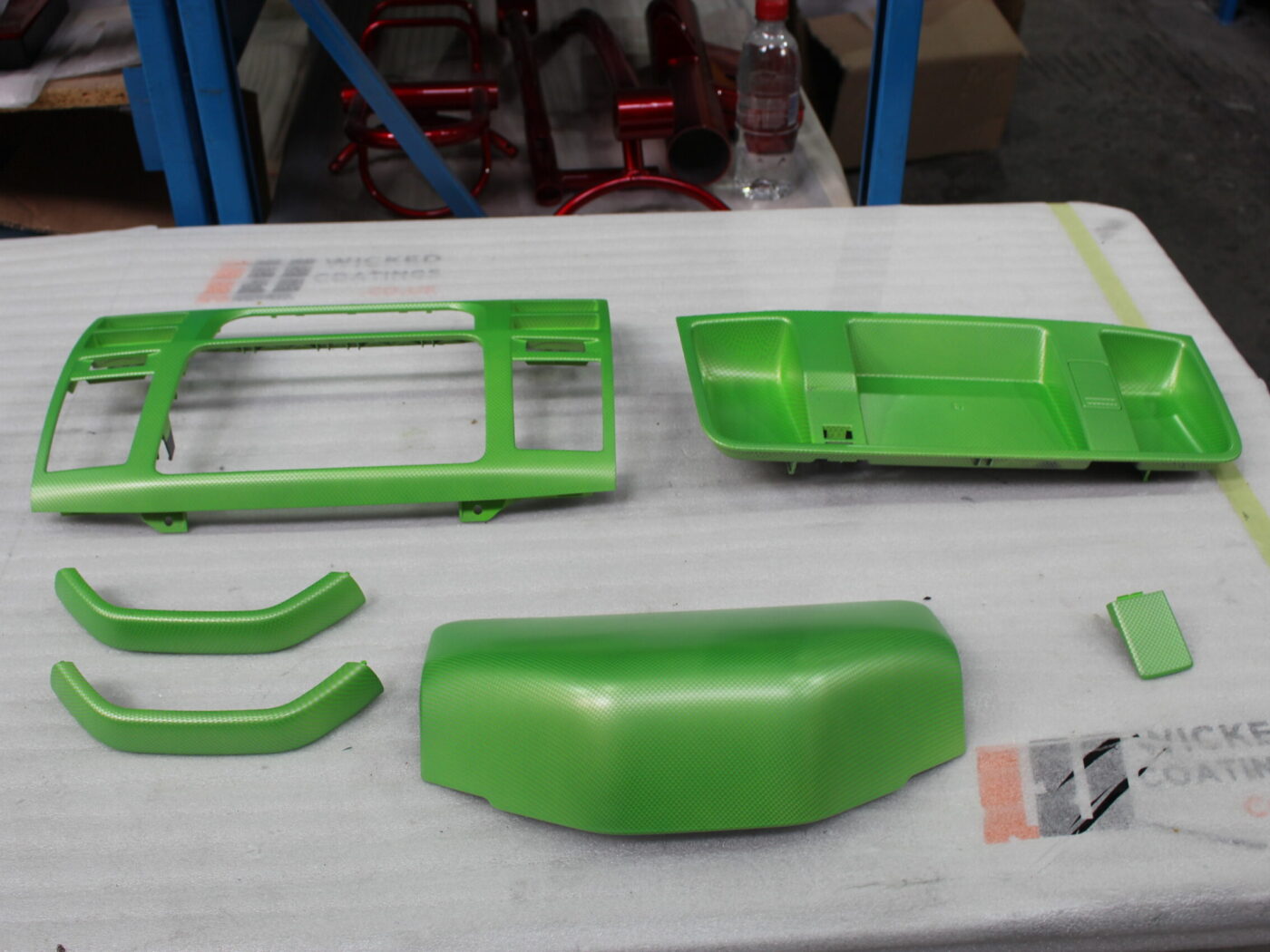 Car interior elements coated in carbon fibre painted green