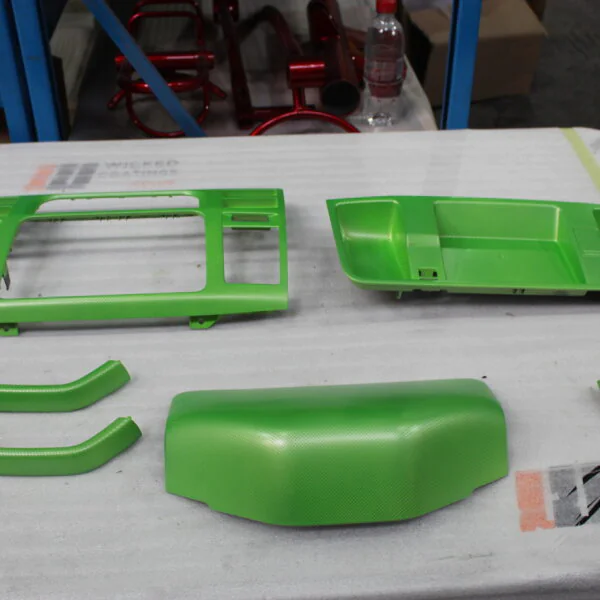 Car interior elements coated in carbon fibre painted green