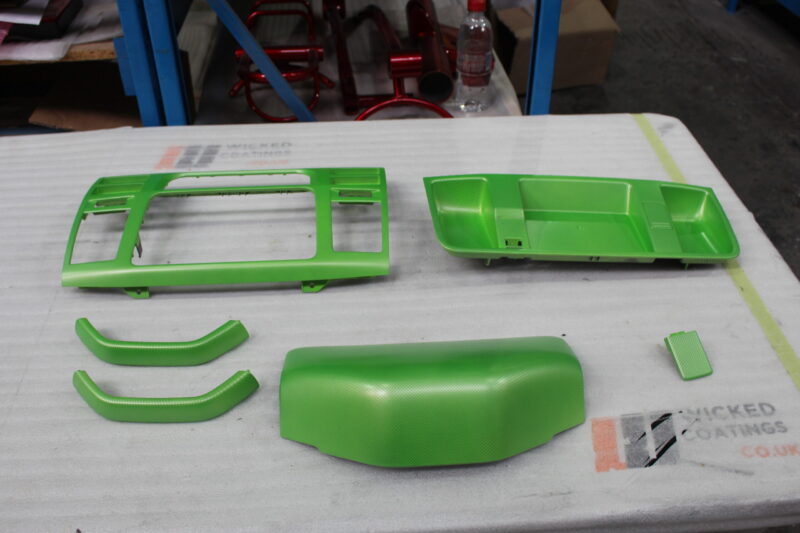 Car interior elements coated in carbon fibre painted green