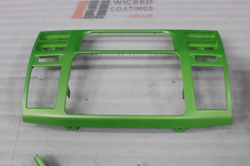 Car interior elements coated in carbon fibre painted green