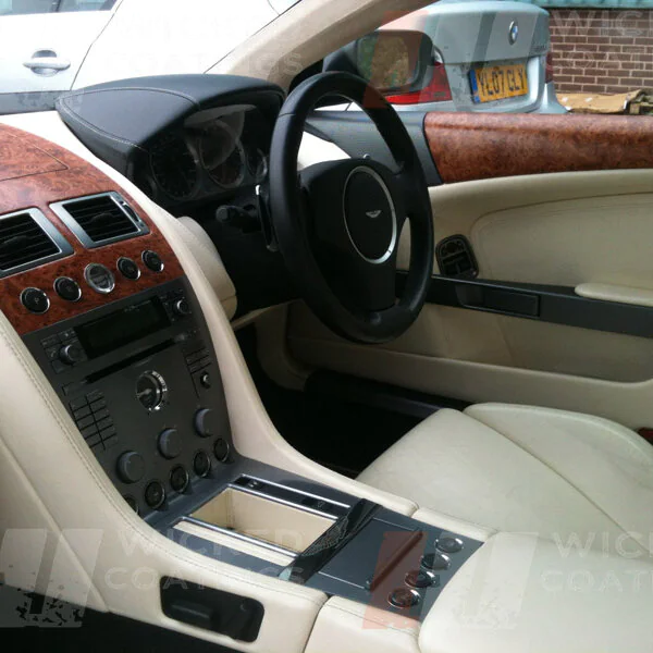 Aston Martin parts of dashboard coated in wood