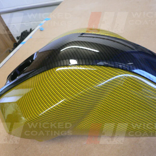 Motorbike tank coated in carbon fibre painted gold