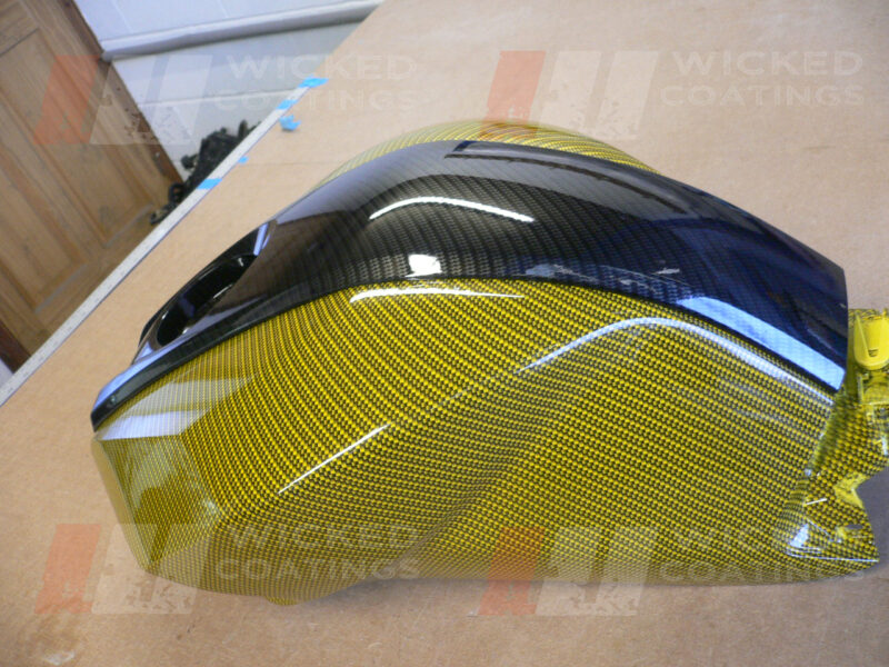 Motorbike tank coated in carbon fibre painted gold