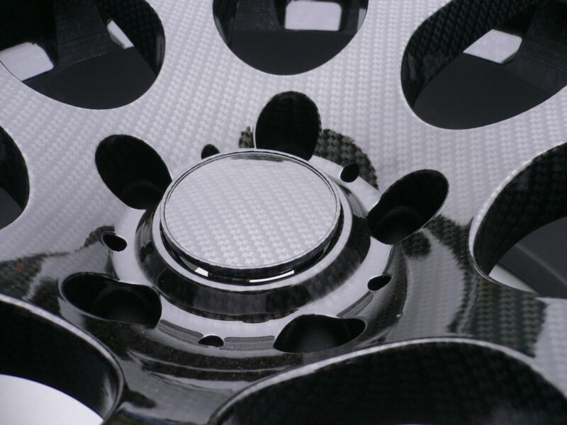 Car alloy wheels coated in carbon fibre