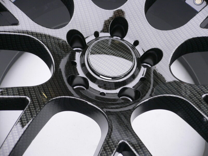 Car alloy wheels coated in carbon fibre