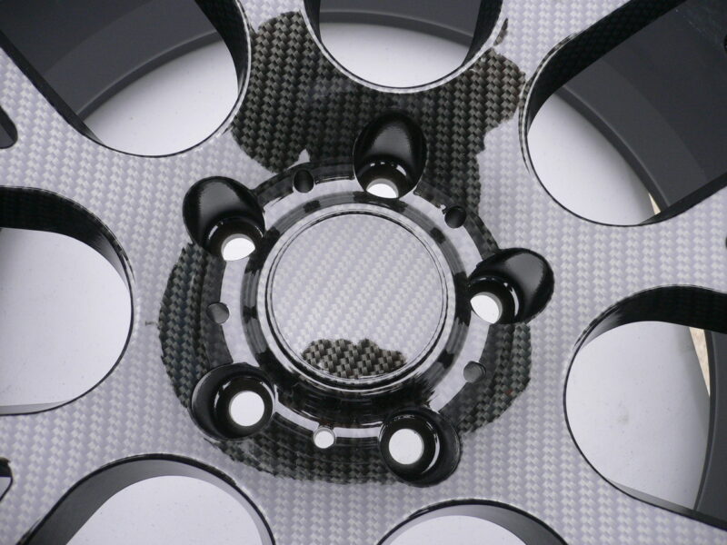 Car alloy wheels coated in carbon fibre