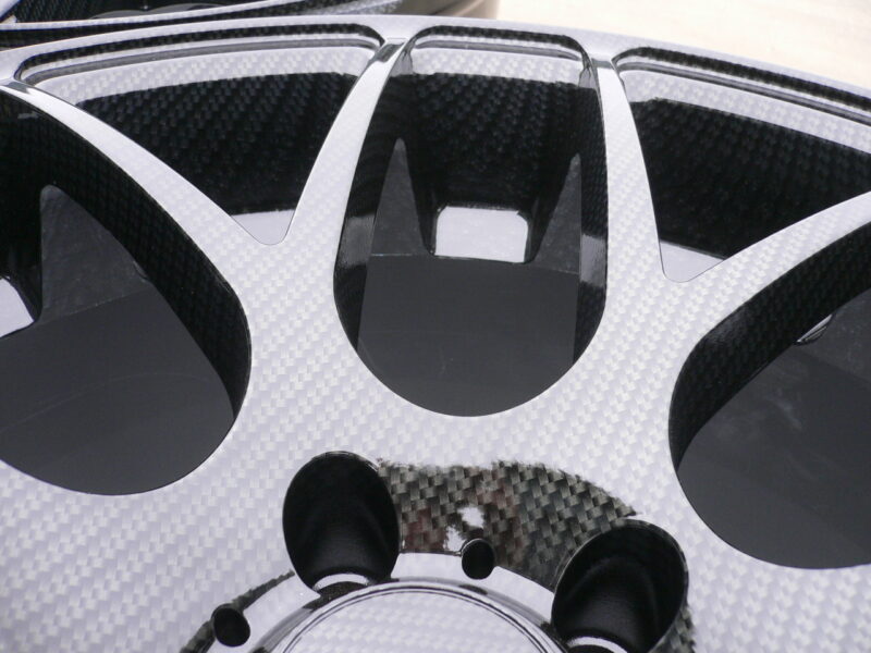 Car alloy wheels coated in carbon fibre