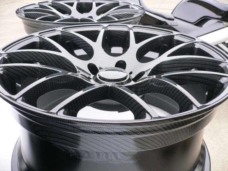 Car alloy wheels coated in carbon fibre