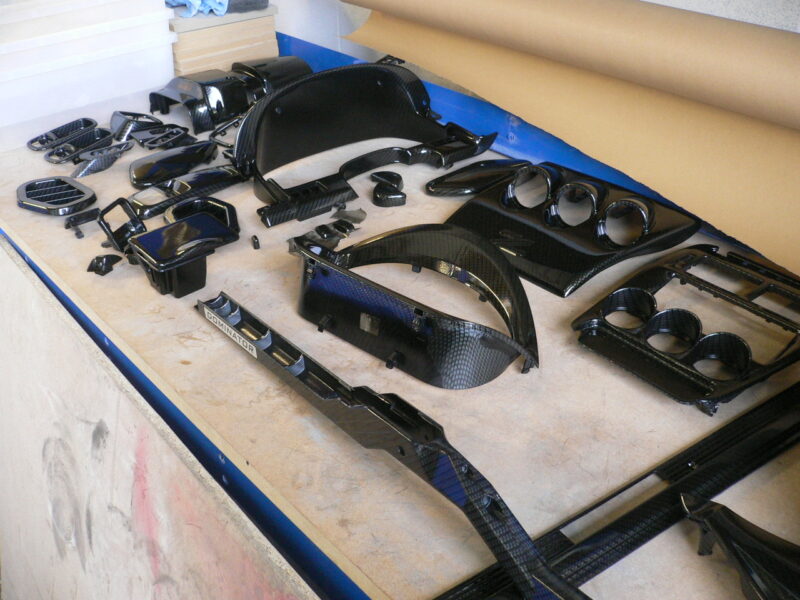 Car interior various elements coated in carbon fibre hydrographic film painted black