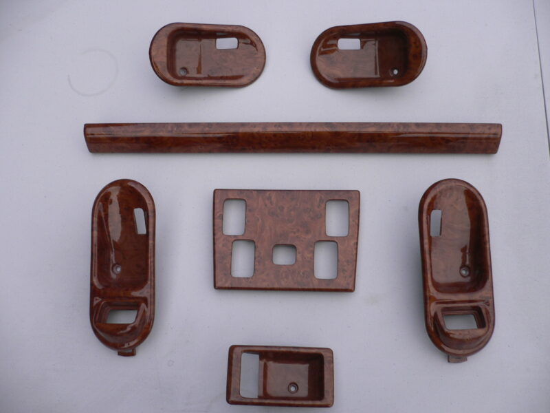 Various car interior elements coated in wood hydrographic film