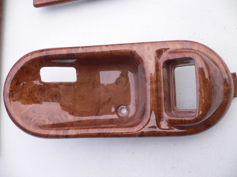 Various car interior elements coated in wood hydrographic film
