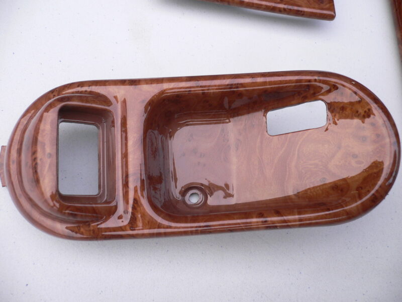 Various car interior elements coated in wood hydrographic film