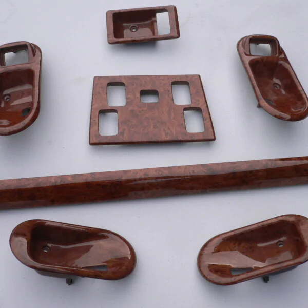 Various car interior elements coated in wood hydrographic film