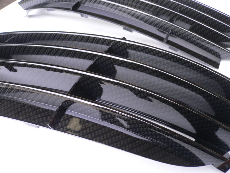 Car radiator cover coated in carbon fibre hydrographic film painted black