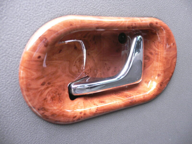 Various car interior elements coated in wood hydrographic film