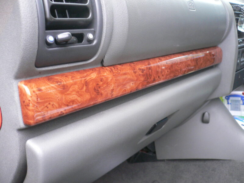 Various car interior elements coated in wood hydrographic film