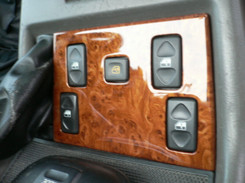 Various car interior elements coated in wood hydrographic film