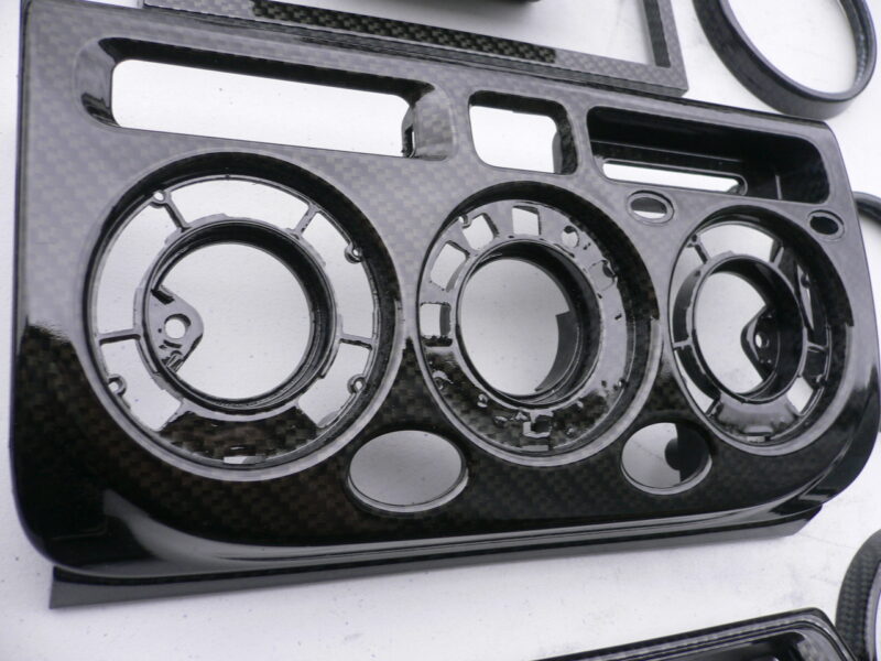 Car interior various elements coated in carbon fibre hydrographic film painted black
