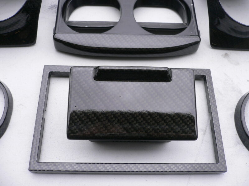 Car interior various elements coated in carbon fibre hydrographic film painted black