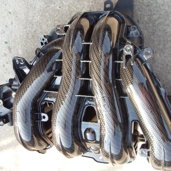 Car engine parts coated in carbon fibre