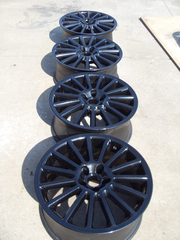 Car alloy wheels coated in carbon fibre